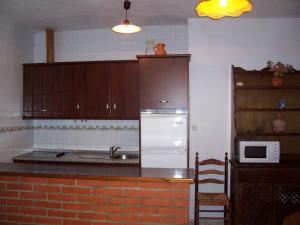 Virtuvė arba virtuvėlė apgyvendinimo įstaigoje Casa Amigo