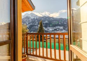 a balcony with a view of the mountains at Aosta Holiday Apartments - Edelweiss in Aosta