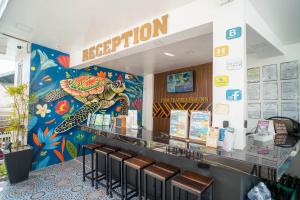 a restaurant with a turtle painted on the wall at Prim Travellers Inn in Coron