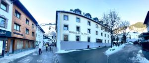 a building on a street with snow on the ground at Haus Steffeler in Sankt Anton am Arlberg