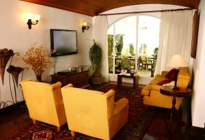 TV a/nebo společenská místnost v ubytování Pousada Villa Capivary Campos do Jordão