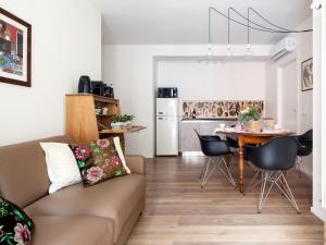 a living room with a couch and a table at Laguna Boutique Apartments in Mestre