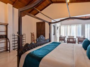 a bedroom with a large bed in a room at Florain Otium Talpe in Unawatuna +25 photos