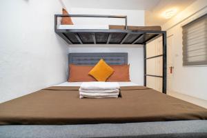 a bed in a small room with a loft bed at Prim Travellers Inn in Coron +290 photos