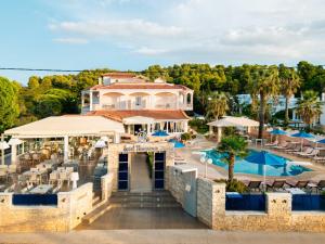 an aerial view of a resort with a pool at Hotel Panorama in Koukounaries +3 photos