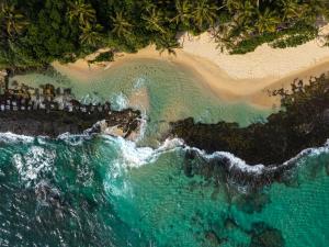 an aerial view of a beach and the ocean at Florain Otium Talpe in Unawatuna
