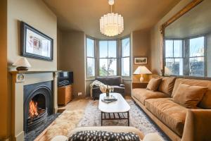 a living room with a couch and a fireplace at Hastings View in Hastings