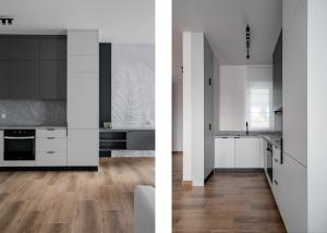 two views of a kitchen with white cabinets and wood floors at Apartamenty Szelągowskiej in Raszyn +1 photo