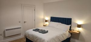 a bedroom with a bed with two towels on it at Sullane Weirs in Macroom