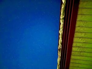 a view of the sky from a window at Udo Daol Pension in Jeju +5 photos