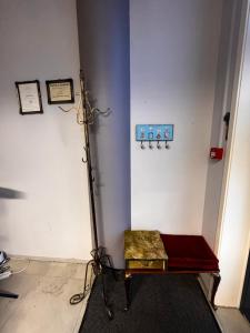 a room with a bench in the corner of a room at Royal Velvet Studio in Kristiansand