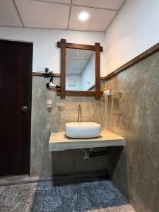 a bathroom with a sink and a mirror at Sigiriya Lantern Homestay in Sigiriya +45 photos