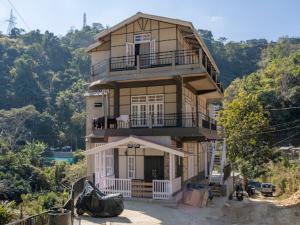 a large house on top of a hill at Teecee in Āīzawl