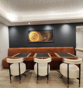 a dining room with a table and chairs at 55 Hôtel Montparnasse in Paris