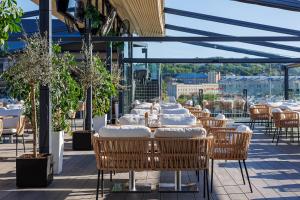 a row of tables and chairs on a patio at Eurohotel in Lviv