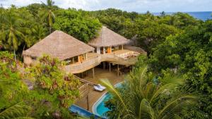 an aerial view of a resort with a swimming pool at Soneva Fushi in Baa Atoll