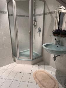 a bathroom with a shower and a sink at Villa Altdorf in Ettenheim +40 photos