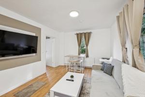 a living room with a couch and a table at Ramoni Apartments - Bad Wildbad in Bad Wildbad