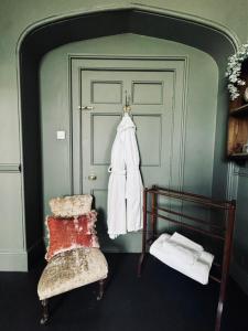 a room with a bed and a chair and a door at The Citadel in Weston +58 photos
