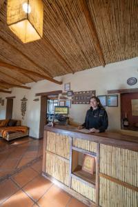 a man sitting at a counter in a room at Hostal Apuwara in Combarbalá +53 photos