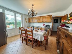 a kitchen with a table with chairs and a dining room at Relax in Lucca - Private Swimming Pool in Lucca +10 photos