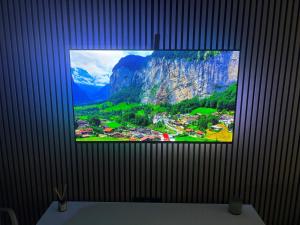a television screen with a picture of a mountain at Perfect Location 2 Bed Apart Medina Del Zoco in Sitio de Calahonda
