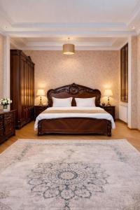 a large bedroom with a large bed with two night stands at Urban Nest old Tbilisi hotel in Tbilisi City