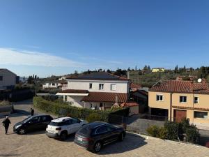 a group of cars parked in a parking lot at APARTMENTS EDWINA in Portorož