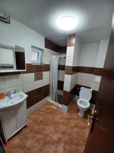 a bathroom with a toilet and a sink at Chaty Antónia in Hriňová +53 photos