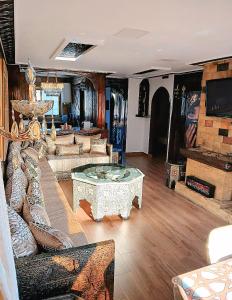 a living room with couches and a table at Ray CaboNegro Sea & Pool View in Cabo Negro