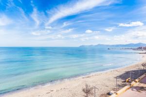 a view of a beach with the ocean at Orellana in Can Picafort