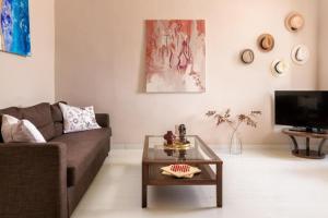 a living room with a couch and a coffee table at Aerino in Symi