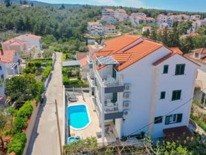 an aerial view of a house with a swimming pool at Villa Supe in Supetar