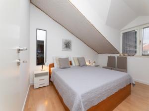 a white bedroom with a bed and a window at Villa Supe in Supetar +94 photos