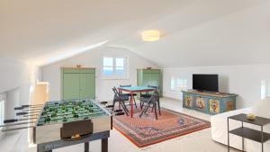 a living room with a table and a foosball at Villa Pigini by Villas Guide in Livade