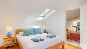 a bedroom with a bed with two towels on it at Villa Pigini by Villas Guide in Livade +34 photos