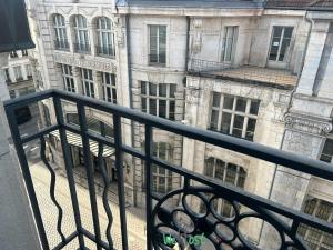 a view of a building from a balcony at Studio bien équipé à Besançon in Besançon