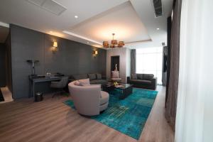a living room with a couch and a table at Wish More Hotel Istanbul in Istanbul +68 photos