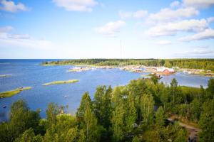 a view of a river with boats in the water at Fisherman's cottage in Björköby