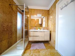 a bathroom with a shower and a sink at LITORAL COSTA DORADA - CORAL Only families in Cambrils +35 photos