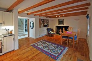a kitchen and dining room with a table and a kitchen and a living room at 3 Bed in Sneem oc-i136 in Sneem