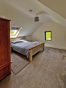 a bedroom with a bed and a window at 3 Bed in Sneem oc-i136 in Sneem