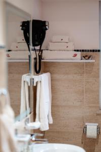a bathroom with white towels and a sink and a mirror at Vila Diamond in Saturn +28 photos