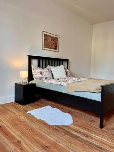 a bedroom with a large bed with pillows on it at Ferienwohnung in Cammer