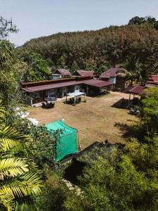 an aerial view of a house in a forest at Mukda in Ko Yao Noi