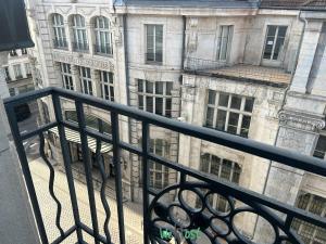 a view of a building from a balcony at Petit cocon confortable à Besançon in Besançon +4 photos