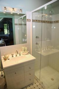 a bathroom with a sink and a shower at Salamander Bay Bed and Breakfast in Salamander Bay