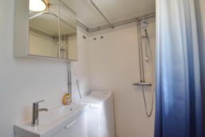 a bathroom with a toilet and a sink and a shower at "Lönnebo" in Lönneberga +32 photos