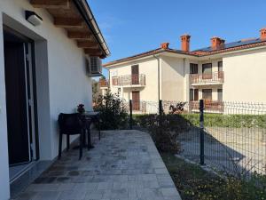 a patio with a table in front of a building at APARTMENTS EDWINA in Portorož
