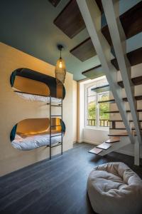 a room with two bunk beds and a large window at ILE WRACH - Duplex de luxe avec magnifique vue mer in Landéda